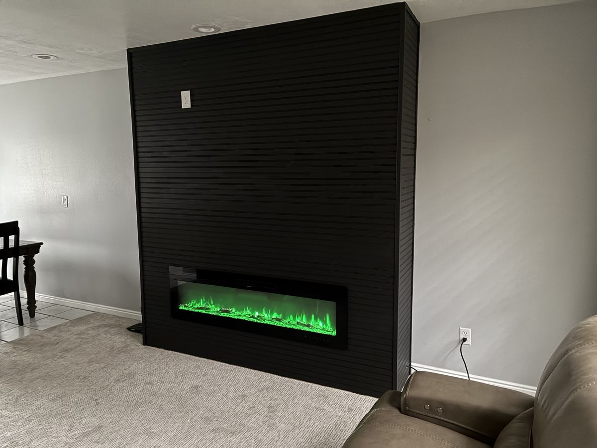 Finished fireplace with green lighting